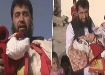 Pakistanlı doktor, 60’ıncı çocuğunu kucağına aldı